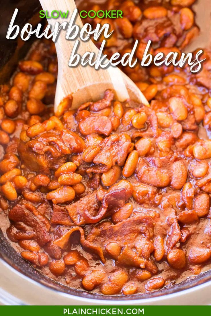 the beans are being cooked in the crock pot with a wooden spoon on top