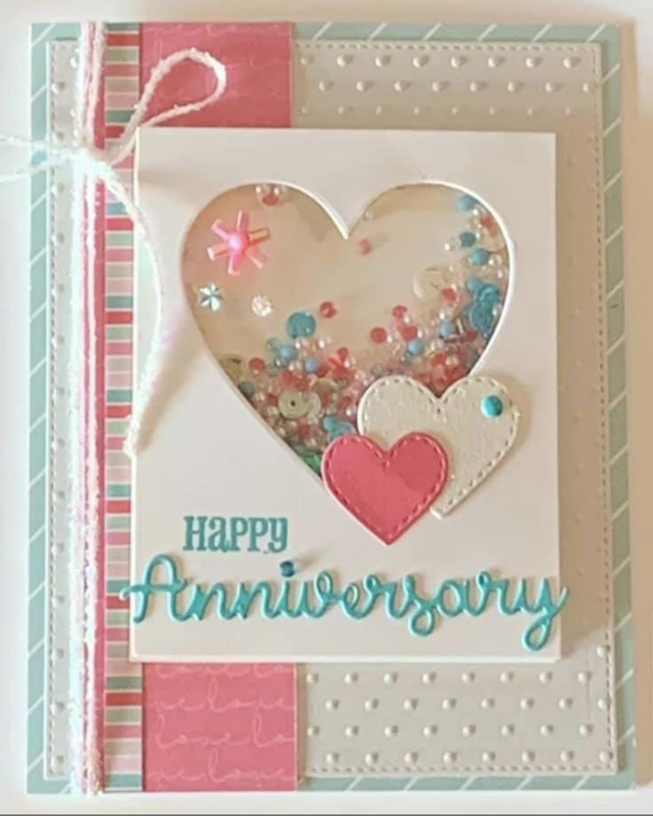 a happy anniversary card with a heart on it