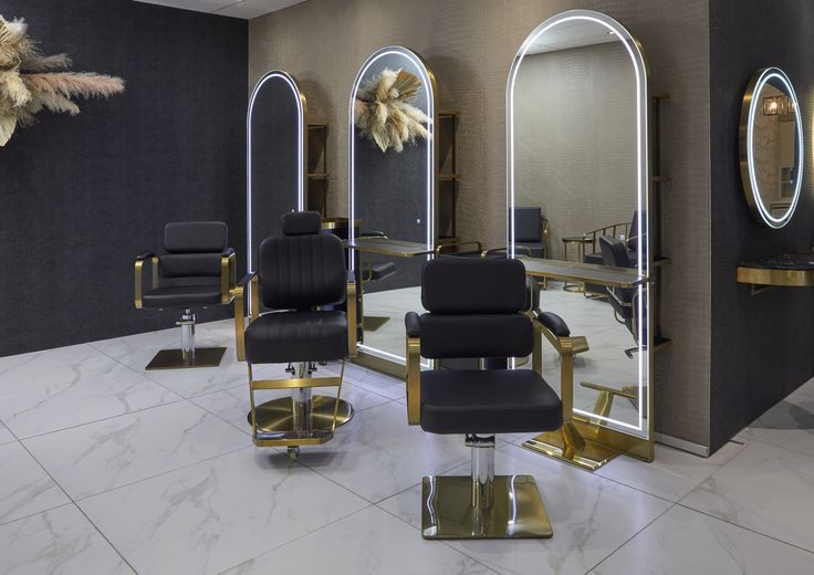 a salon with chairs and mirrors in it