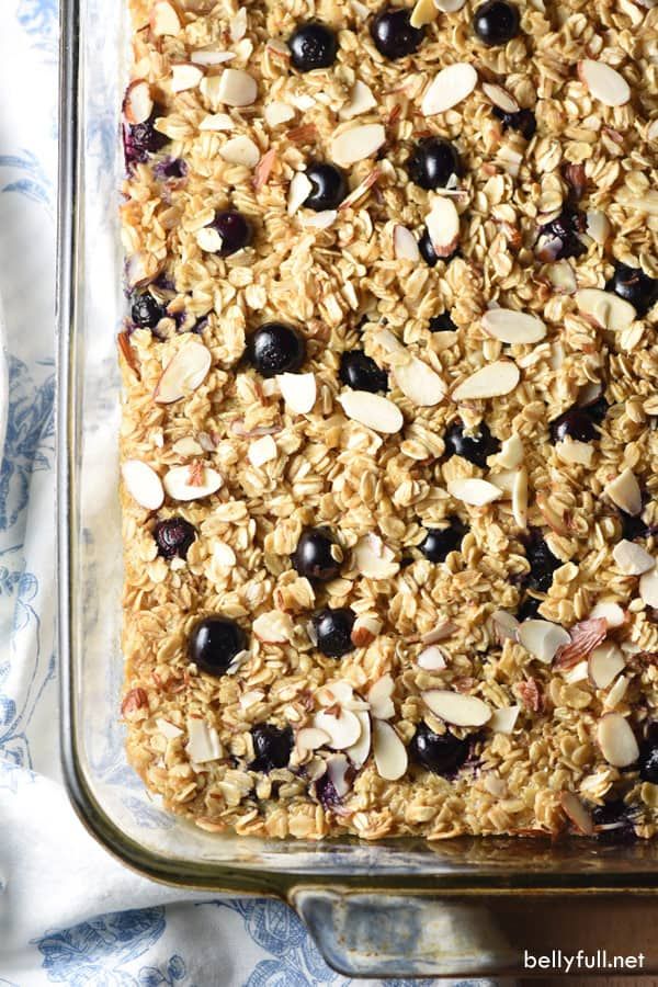 baked oatmeal with blueberries and almonds in a glass baking dish