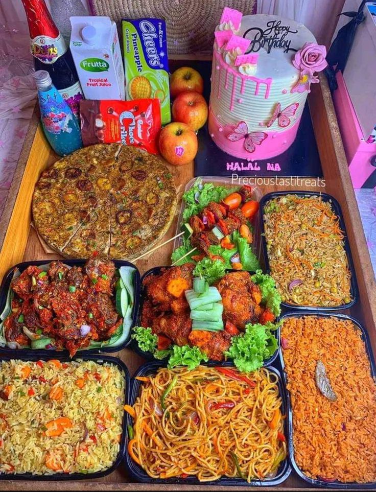 several trays filled with different types of food