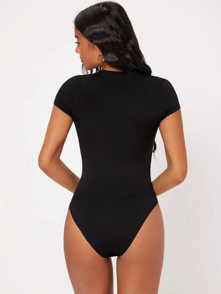 This slim-fit, Solid Colored Slim Fit Bodysuit is perfect for any occasion. Crafted from a medium stretch material, this top is made from 91% Polyester and 9% Elastane for a comfortable fit. It features a classic round neckline and a natural waistline. The fabric is lightweight and breathable, making it ideal for warmer days. Add this classic piece to your wardrobe for effortless style. Specifications: Pattern Type: Plain Neckline: Round Neck Sleeve Length: Cap Sleeve Fit Type: Slim Fit Waist Line: Natural Fabric: Medium Stretch Material: Fabric Composition: 91% Polyester, 9% Elastane Care Instructions: Machine wash or professional dry clean Product Measurements(cm): Size US Bust Cuff Hip Size Length Shoulder Sleeve Length Waist Size XS 2 68 23.8 61.5 69.6 31.5 12.5 56 S 4 72 25 65.5 70.8 Basic Solid Color Elastane Bodysuit, Fitted Solid Color Bodysuit With Scoop Neck, Casual Bodysuit With Minimal Stretch, Slim Fit Elastane Bodysuit, Stretch Bodysuit With Scoop Neck In Solid Color, Stretch Scoop Neck Bodysuit In Solid Color, Scoop Neck Stretch Bodysuit In Solid Color, Casual High Stretch Crew Neck Short Sleeve Bodysuit, Casual High Stretch Crew Neck Bodysuit