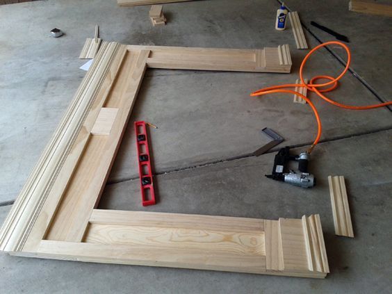 the tools are laying out on the floor next to some wood planks and wires