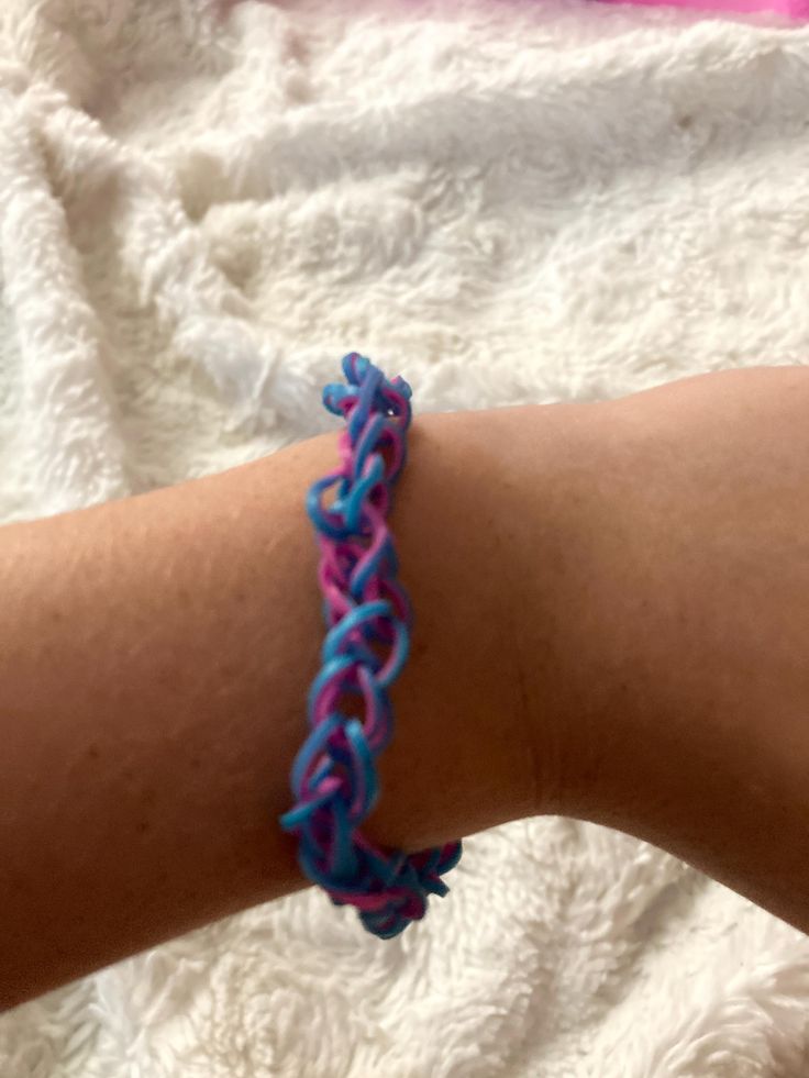 Blue and pink rubber band bracelet Adjustable Blue Band Bracelets, Blue Adjustable Braided Bracelet, Cheap Hand-strung Blue Bracelets, Adjustable Blue Woven Bracelet, Adjustable Blue Hand-strung Braided Bracelets, Rubber Band Bracelet, Band Bracelet, Pink Bracelet, Braided Bracelets