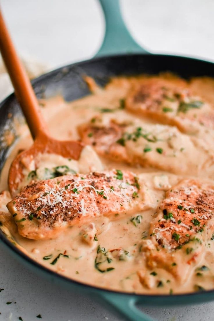 a skillet filled with meat covered in gravy