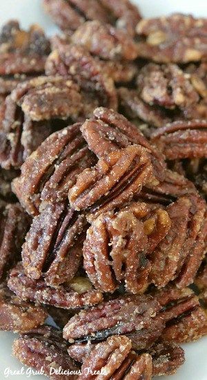 pecans are piled on top of each other in a white plate and ready to be eaten