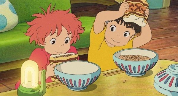 two children sitting at a table with bowls of cereal in front of them and one boy holding his head