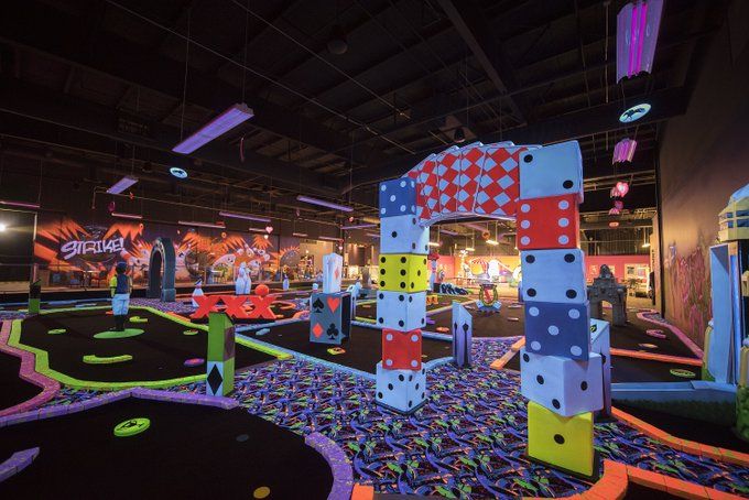 an indoor miniature golf course at the children's museum