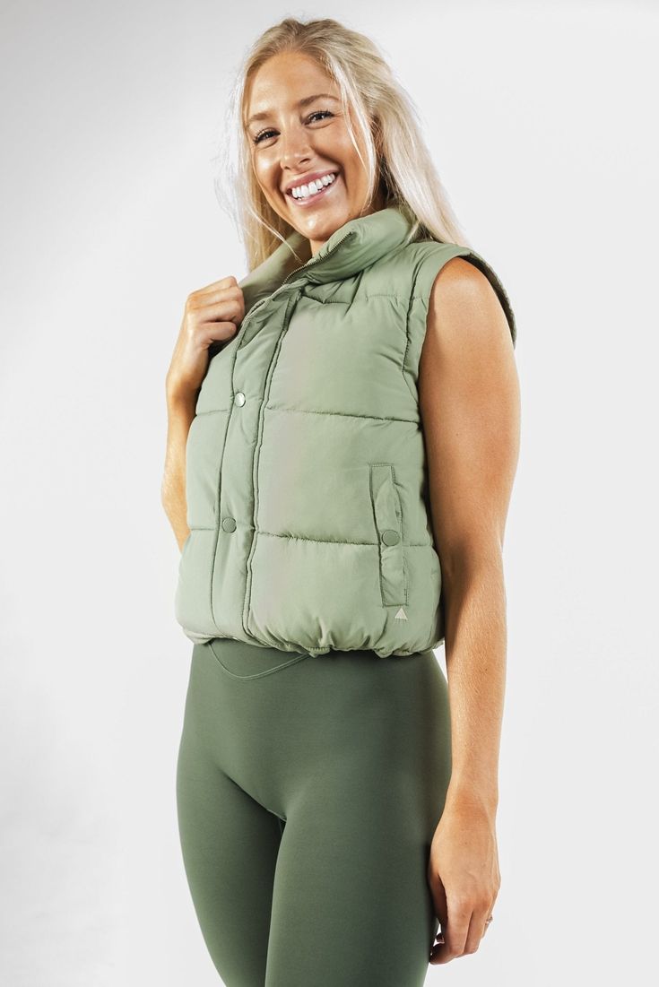 Our Vitality Convertible Puffer is designed to keep you warm without the extra bulk. This jacket is the perfect choice for anyone seeking a balance between warmth and mobility in their outerwear. Functional Puffer Outerwear In Solid Color, Functional Solid Puffer Outerwear, Versatile Nylon Outerwear For Winter, Sporty Puffer Outerwear For Outdoor Activities, Nylon Athleisure Outerwear For Cold Weather, Athleisure Nylon Outerwear For Cold Weather, Versatile Puffer Outerwear For Outdoor, Fitted Athleisure Outerwear For Cold Weather, Functional Windproof Puffer Jacket For Fall