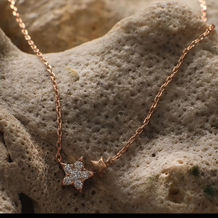 Description You will be reminded of your birth star every time you choose to wear the Estrella Minimal Necklace. It is rose gold plated in high polish with a little, twinkling star motif adding to this jewelry's celestial charm. Wear it by itself or layer it with other necklaces for a more glamorous look. Product Information Materials used: 925 Silver with White Rose Gold Plating Stones: High Grade CZ Stones Length: 21 cm and adjustable Findings: Hook and links Elegant Rose Gold Necklace With Star Charm, Dainty Rose Gold Cubic Zirconia Charm Necklaces, Dainty Rose Gold Charm Necklaces With Cubic Zirconia, Dainty Rose Gold Charm Necklace With Cubic Zirconia, Dainty Rose Gold Jewelry With Star Charm, Dainty Star-shaped Rose Gold Jewelry, Rose Gold Charm Necklace With Star Charm, Rose Gold Celestial Jewelry With Star Charm, Dainty Rose Gold Star Jewelry