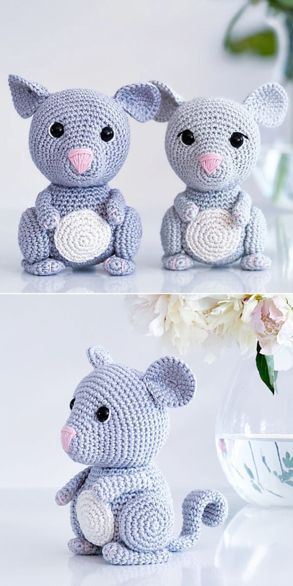 crocheted koala stuffed animal sitting next to a vase with flowers in it