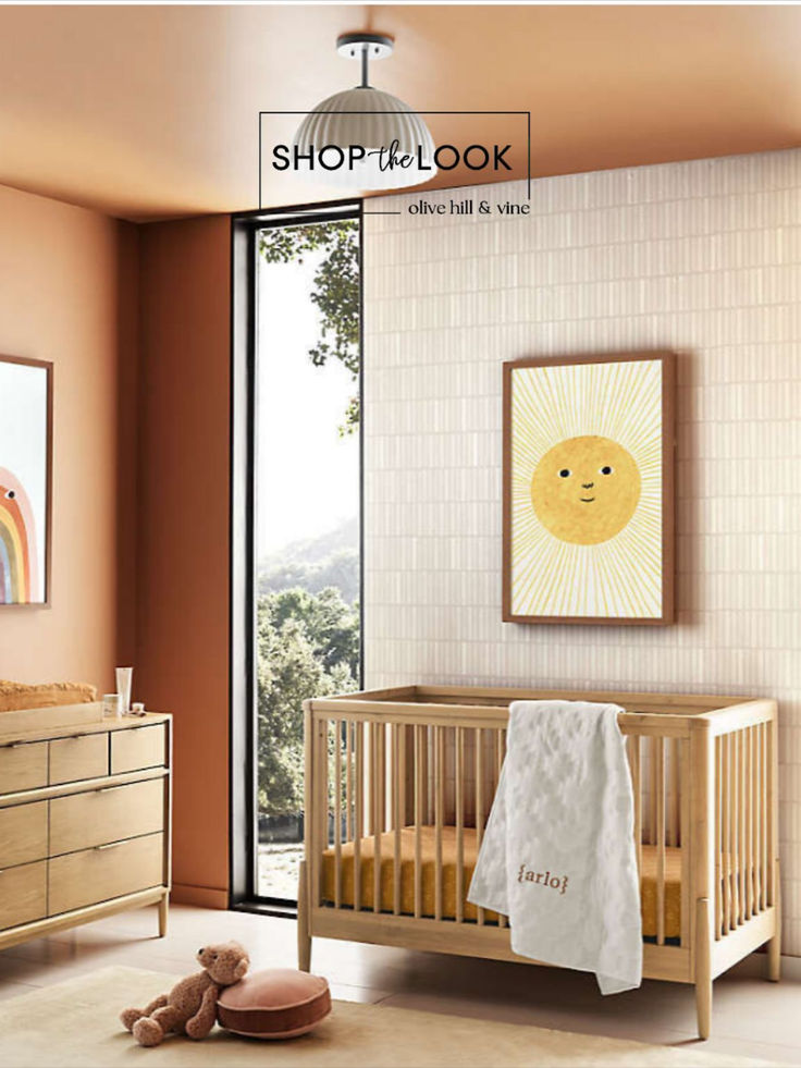 Nursery decor inspo-wood tones with hand-drawn artwork of a cute sun with beams and a smiling face, a second piece artwork of a rainbow with a face. Gender neutral color palette. Nursery Wabi Sabi, Modern Nursery Inspiration, Palm Springs Nursery Decor, Orange Wall Nursery, Bright Boho Nursery, Nursery With Daybed And Crib, Artistic Nursery, Artsy Nursery, Wabi Sabi Kids Room