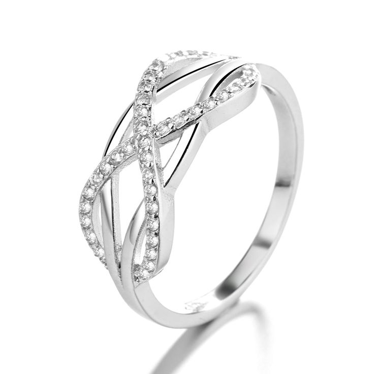 The Sterling Silver Intertwined Ring with Swarovski® Crystals is a stunning and unique piece of jewelry that combines the beauty of sterling silver with the sparkle of Swarovski crystals. The ring features two intertwined bands that are made of high-quality sterling silver, which gives the ring a sleek and polished look that is both elegant and sophisticated. The intertwining bands of the ring are embellished with crystals from Swarovski, which are finely crafted and polished to a high shine. Th Coffee And Espresso Maker, Elegant Ring, Sterling Silver Bands, The Ring, Polished Look, Eternity Ring, Silver Band, Women Rings, Women's Accessories