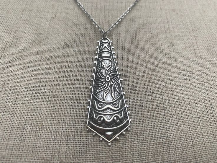 "Unique, funky and stylish boho pendant necklace. It has incredible detail and design. This is a very versatile piece and would be perfect for everyday wear. The pendant measures 2\" long by 3/4\" wide. Made from allergy free plated silver. It hangs from a shiny strong 18\" stainless steel necklace chain with a lobster clasp. I have matching earrings in my shop if you would like the whole set. Here is a direct link https://etsy.me/31dVEuN Thanks for stopping by! Please take a moment and visit th Nickel Free Bohemian Necklace For Festivals, Bohemian Adjustable Soldered Necklaces, Bohemian Nickel-free Necklace For Festivals, Nickel-free Bohemian Necklace For Festival, Bohemian Nickel-free Pendant Necklace, Bohemian Nickel-free Necklaces, Bohemian Handmade Teardrop Pendant Necklace, Bohemian Etched Silver Necklace, Bohemian Pendant Necklaces With Oxidized Finish