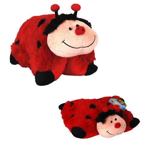 two red stuffed animals laying next to each other