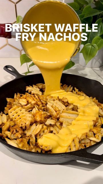 a skillet with cheese being poured into it and the words, brisket waffle fry nachos