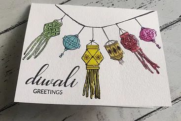 a greeting card with an image of a fire hydrant hanging from it's string