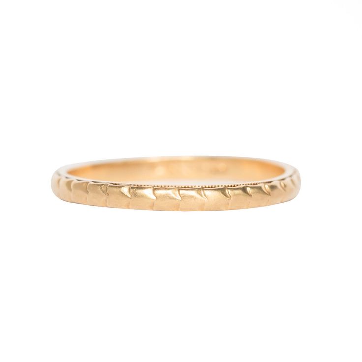 *VIEW A VIDEO OF THIS RING* https://youtu.be/lfOF91wmK-Q Description: This piece is a 1910s Edwardian era 14k Yellow Gold wedding band. It features a continuous pattern throughout the band, making it simple and elegant to pair nicely with and engagement ring! This is a true antique piece, and we are honored to offer it to our Etsy family. This ring can be sized up or down 4 sizes for an additional $30. If you wish to have a ring sized please purchase the item and note the size in the message sec Heirloom 14k Gold Diamond Cut Band, Heirloom 14k Gold Band With Diamond Cut, Classic Yellow Gold Milgrain Bands, Ceremonial Yellow Gold Wedding Band With Decorative Details, Classic Yellow Gold Bands With Milgrain, Formal Yellow Gold Bands With Milgrain, Classic Gold Wedding Ring With Milgrain Detail, Timeless Yellow Gold Wedding Bands, Ceremonial Engraved Ring With Decorative 14k Gold Band