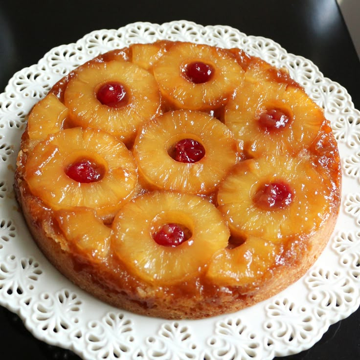 a pineapple upside down cake on a doily