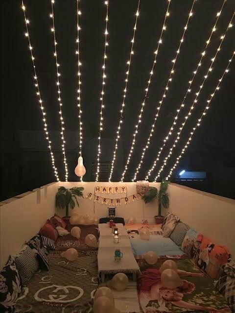 the lights are hanging from the ceiling above the table and couches in the room