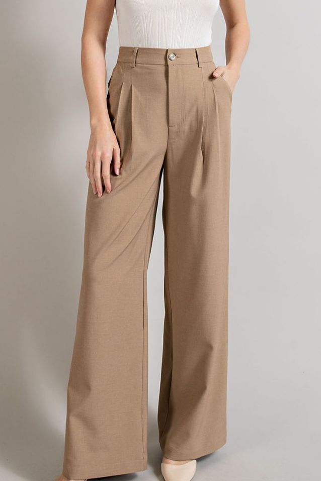 Product Description: Looking for a flowy and relaxed pant? Look no further! Our Coco Straight Leg Pants feature a button front closure and pockets and bring the classic, beautiful look you think of when you think when you think straight leg. Whether you wear these pants with a graphic tee and sneakers or dress them up with a blouse and heels, you won't regret adding these to your closet. Quick Product Details and Features: Material: 95% Polyester, 5% Spandex Straight leg. Button front closure. P Affordable Oversized Straight Leg Pants, Cheap Straight Leg Bottoms For Summer, Affordable Trendy Solid Wide Leg Pants, Versatile Solid Color Cheap Pants, Affordable High-waisted Casual Pants, Cheap Spring Straight Leg Chinos, Affordable Cotton Straight Work Pants, Fall Pants 2022 Women, Cheap Slim Fit Pants For Spring