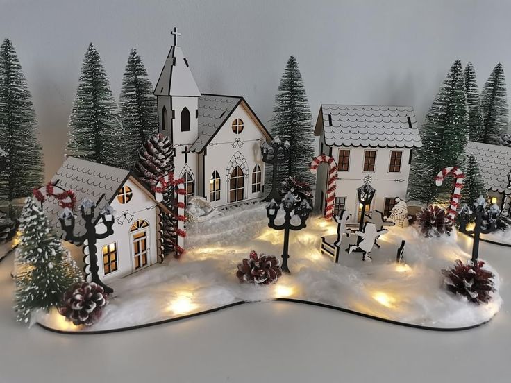 a christmas village with lights and decorations