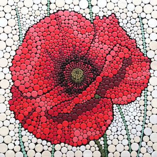 a red flower made out of bottle caps on a white background with green stems and dots