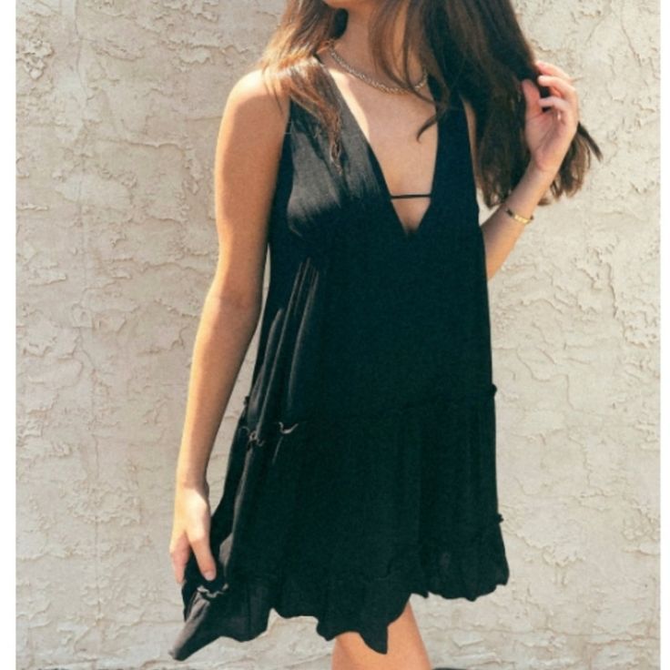 100% Rayon Lining: 100% Rayon. * Hand Wash Cold. * Made In China. * Model Is Wearing Size Small: Length: 34" Bust: 34" Waist: 18". Black V-neck Sleeveless Sundress, Sleeveless Black Mini Dress For Summer, Chic Black Halter Neck Sundress, Black Sleeveless Summer Dress For Party, Black Flowy Sleeveless Casual Dress, Black Halter Neck Sleeveless Dress For Summer, Black Sleeveless Dress For Summer Vacation, Casual Black Sleeveless Flowy Dress, Black Bohemian Sleeveless Sundress