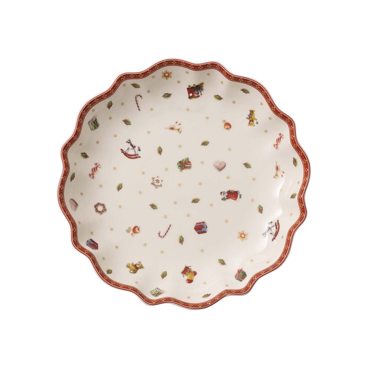 a white plate with red trim and christmas decorations on the rim, against a white background