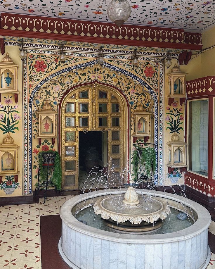 an ornately decorated room with a fountain in the center