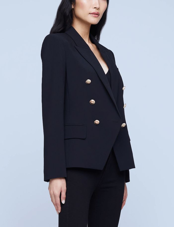 L'Agence Kenzie Double-Breasted Blazer in black. Long sleeves. Gold dome buttons. Button cuffs. Double breasted. Strong shoulders. Front chest pocket. Straight seamed flap pockets. Single back vent. Fully lined. 73% polyester, 20% viscose, 7% spandex. Sleeve length: 25". About 26.25" from shoulder to hem. Imported. Great Neck New York, Strong Shoulders, Breasted Blazer, Double Breasted Blazer, How To Be Outgoing, Chest Pocket, Double Breasted, Long Sleeves, Sleeve Length