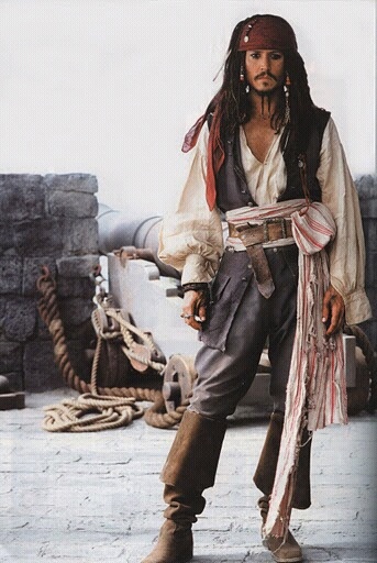 a man dressed as captain jack sparrow on the set of pirates