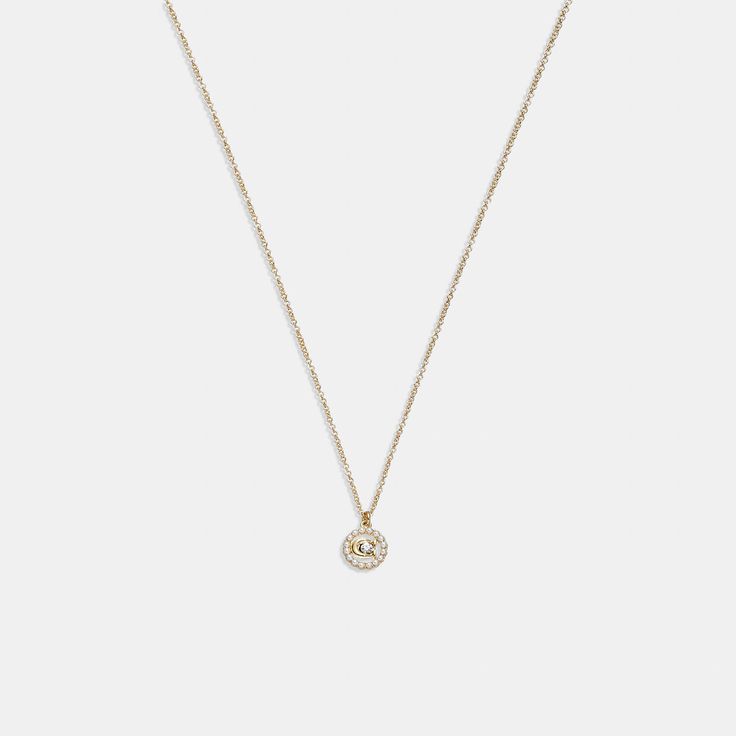 A minimalist look for day or night this pendant necklace features a pearly ring circling our Signature with a shimmering crystal center. The delicate chain necklace is finished with an adjustable clasp to wear long or short. | Coach Signature Crystal Pearl Pendant Necklace - Women's - Gold Circle Ring, Delicate Chain, Pearl Pendant Necklace, Crystal Pearls, Gold Pendant Necklace, Women Accessories Jewelry, Pearl Pendant, Womens Jewelry Necklace, Womens Watches