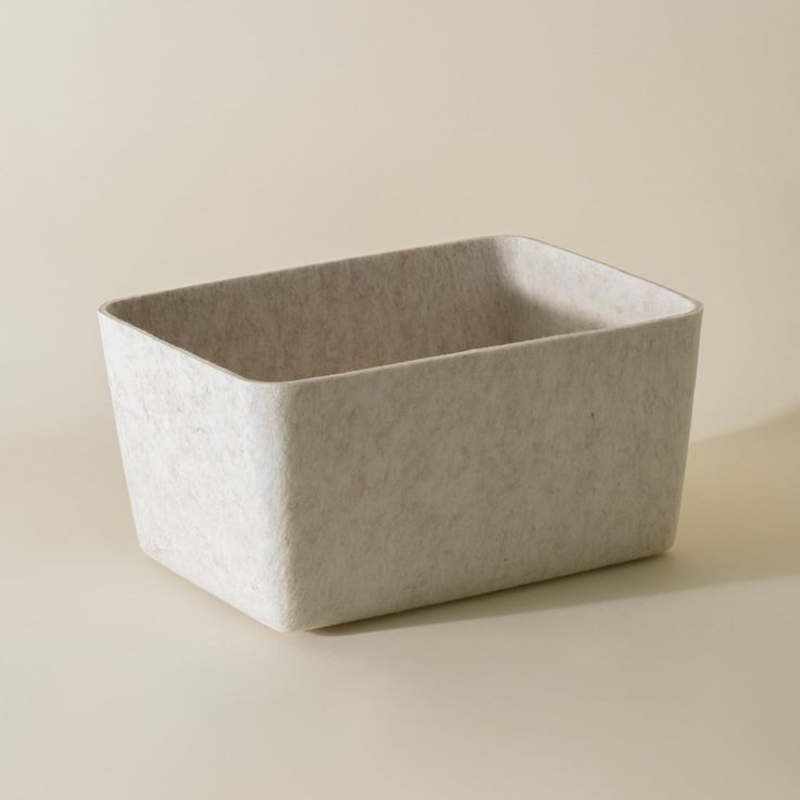 a white square container sitting on top of a table