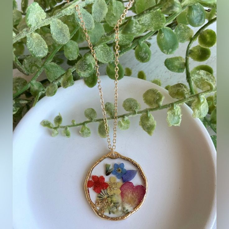 Pressed Wild Flower Necklace | Multi Flower Necklace | Resin Jewelry | Resin Dry Flower Necklace | Resin Dried Flower Necklace Forget Me Not Material: Resin Handmade Item. Materials: 18k Gold Plated Charm: Mix Of Pressed Dried Flowers Circle Charm's Size: 1.19in X 1.19in Heart Charm's Size: 1.57in X 1.18in Necklace's Length: 27in With 3in Extension Please Note That Due To Flower's Color Shade, Lighting Effects, Monitor's Brightness, Contrast And Other Settings, There Might Be Some Slight Differe Resin Necklace With Photo, Resin Pendants Flower, Flower Pressed Necklace, Dry Flower Jewelry, Gold Bohemian Flower Necklaces, Bohemian Gold Flower Necklaces, Bohemian Gold Flower Necklace, Mother's Day Pressed Flower Necklace, Multicolor Flower Jewelry With Pressed Flowers