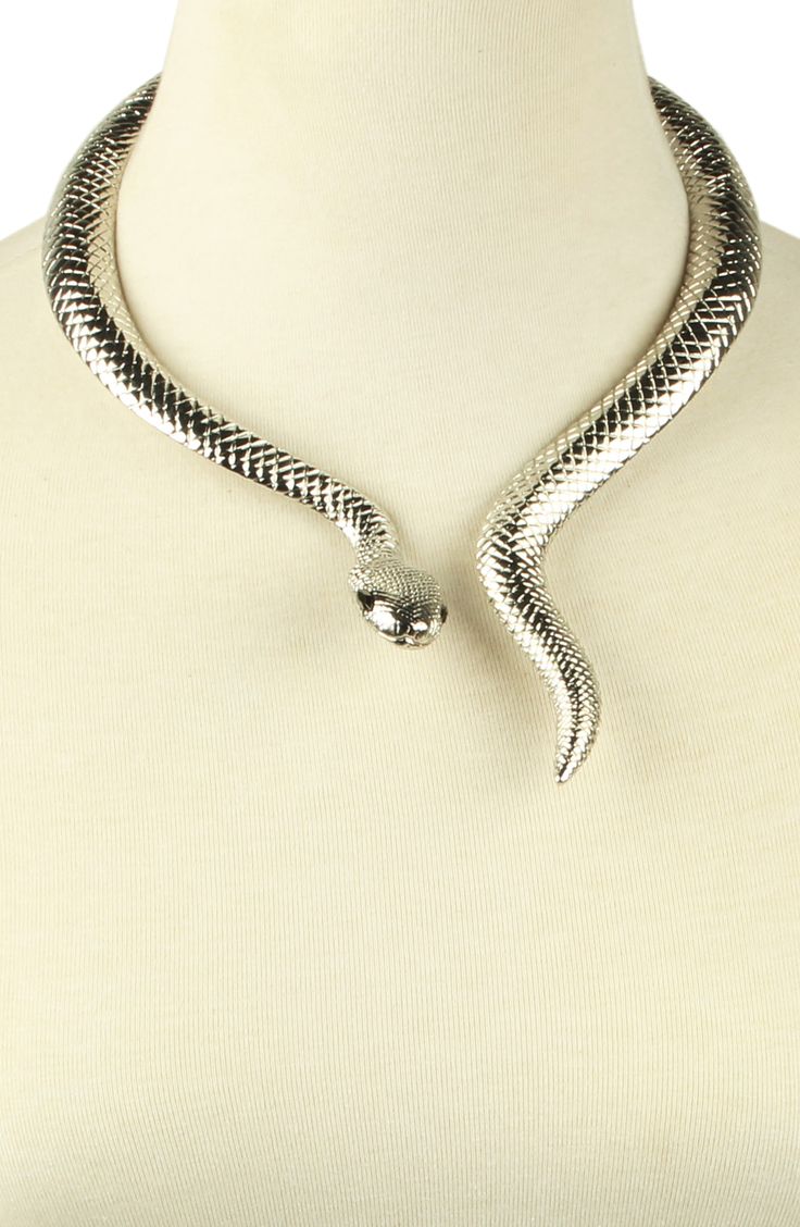 A snake shaped choker necklace adds sultry attitude to your night out looks. 10" length Hinge closure Alloy Imported Silver Snake Accessories, Silver Snake Necklace For Party, Metal Choker For Night Out, Silver Choker For Night Out, Party Snake Chain Metal Choker, Silver Snake Chain Choker For Party, Party Metal Snake Chain Choker, Trendy Snake-shaped Jewelry For Parties, Trendy Snake-shaped Party Jewelry