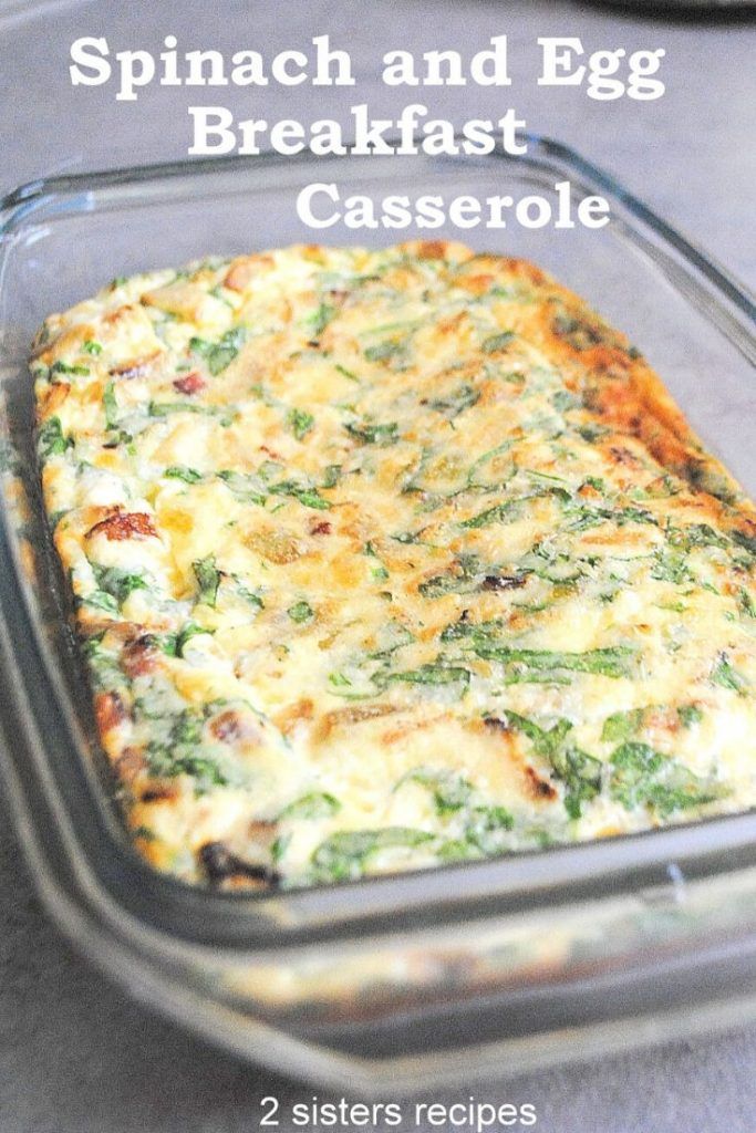 spinach and egg breakfast casserole in a glass baking dish on a table