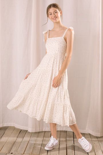 Indulge in comfort and style with this stunning floral eyelet midi dress, perfect for spring, summer, or resort destinations. The straight neckline and adjustable ruffled straps add a touch of romance, while the smocked upper back ensures a comfortable and flattering fit. With its ruffled flowy midi bottom, this dress Feminine Midi Sundress With Ruffles, Spring Midi Dress With Ruffled Straps For Summer, Spring Tiered Midi Dress With Adjustable Straps, Tiered Midi Dress With Adjustable Straps For Spring, Spring Midi Dress With Tie Straps And Tiered Shape, Summer Midi Dress With Adjustable Ruffled Straps, Breezy Brunch Dress With Ruffled Straps, Summer Midi Dress With Ruffled Straps For Brunch, Vacation Midi Dress With Tie Back And Ruffled Straps