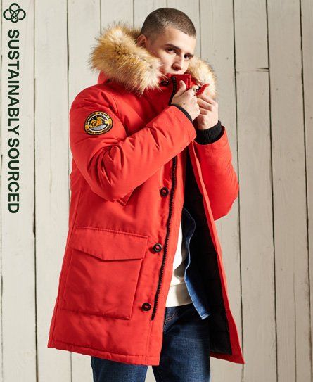 Looking for a new coat for the season? Choose the Everest Parka coat to keep you warm and looking stylish. Designed with a removable faux fur trim, a button and zip fastening and padding made from recycled polyester.   Main button and zip fastening  Removable faux fur trim  Six pocket design  Elasticated cuffs  Signature logo badge   The padding in this jacket is 100% Recycled Polyester – each jacket contains up to 10 recycled bottles, this avoids these bottles being sent to landfill or pollutin Cold Jacket, Superdry Mens, Logo Badge, Hooded Parka, Parka Coat, Parka Jacket, Jackets Online, Red Jacket, Signature Logo