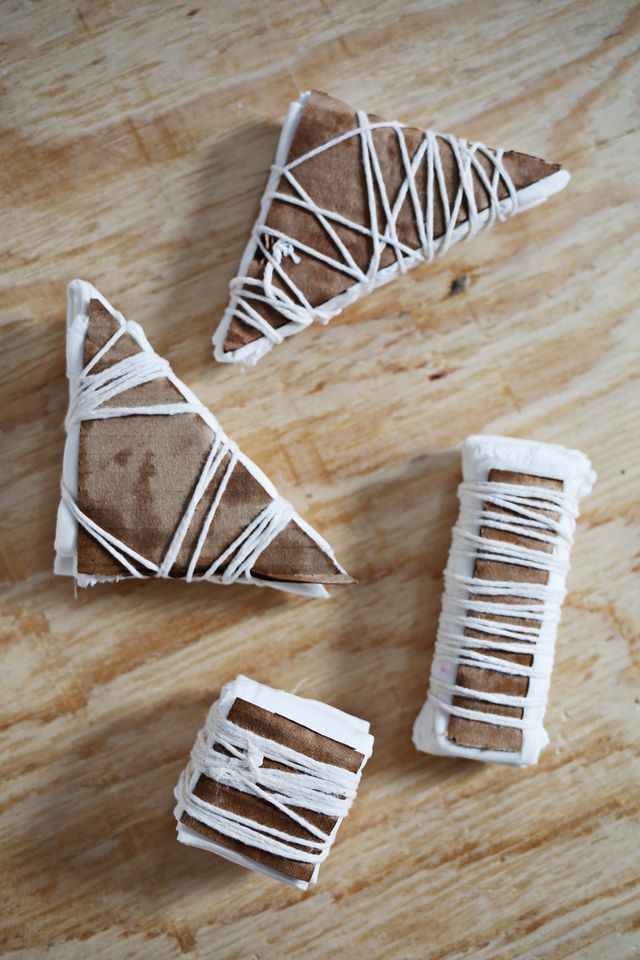 three pieces of cake sitting on top of a wooden table