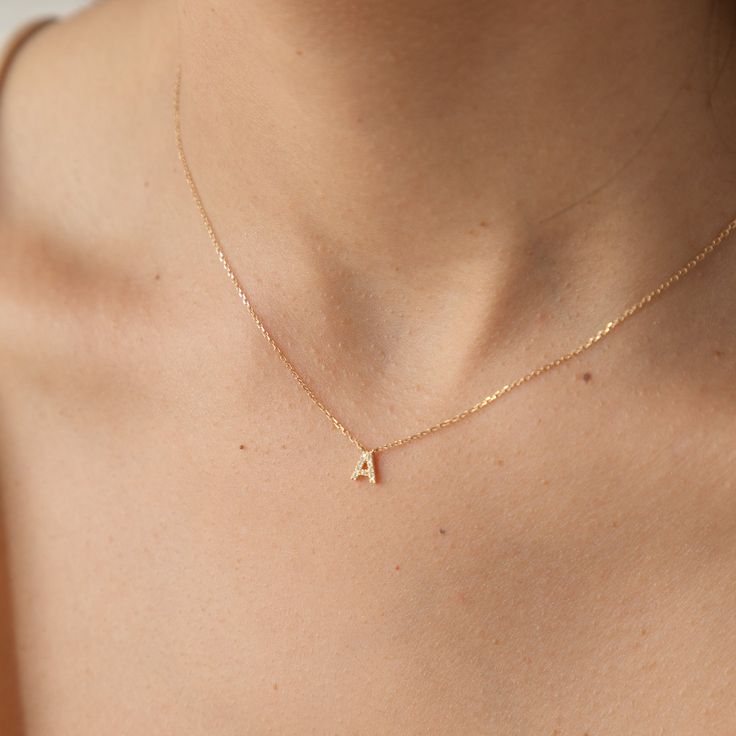 With our Pavé Diamond Tiny Initial Necklace, treasure the beautiful, lasting duo of 14k solid gold and diamonds in a charm personalized just for you. This effortlessly classy necklace is the perfect gift for a new bride, expecting mama, best friend, or even yourself! It’s gentle on sensitive skin and shower safe, so you never need to worry about taking it off. DETAILS 14k solid gold necklace with lab-grown diamonds Necklace length: 16" with 2" extender Necklace thickness: 0.9mm 14k solid gold ch Minimalist Accessories Jewellery, Neck Pieces Jewelry, Classy Necklace, Solid Gold Charms, Dainty Initial Necklace, Wishlist 2024, Diamond Initial Necklace, New Bride, Solid Gold Bracelet