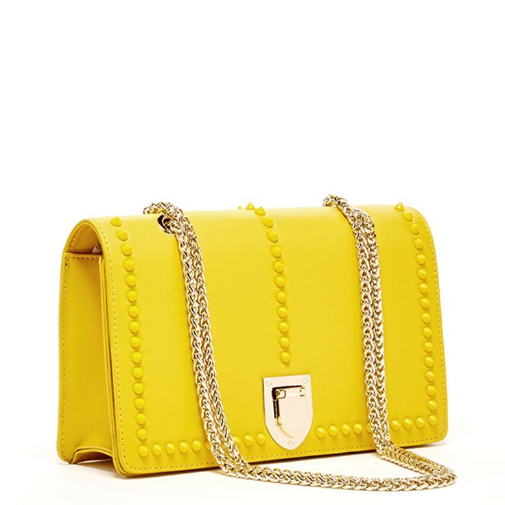 The Josie will take you through the seasons looking trés chic. Made with smooth leather, this trendy forward yellow leather purse features decorative leather studs on its front flap. With a buckle closure, the fabric-lined interior includes a zip pocket, cell phone slip and 6 credit card slots. Its elegant light gold chain strap can be worn long as a stylish crossbody or doubled up for a shorter shoulder bag style. The fashionable Josie worn day to night for all occasions. More details about thi Elegant Leather Shoulder Bag With Rivets, Formal Leather Bags With Studs, Elegant Evening Shoulder Bag With Rivets, Yellow Leather Bags With Metal Hardware, Formal Yellow Shoulder Bag With Chain Strap, Elegant Rectangular Studded Shoulder Bag, Yellow Leather Bag With Chain Strap, Elegant Rectangular Bag With Rivets, Elegant Rectangular Bags With Rivets