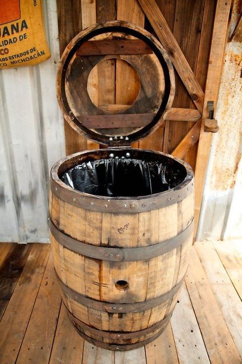 an old wooden barrel sitting on top of a wooden floor