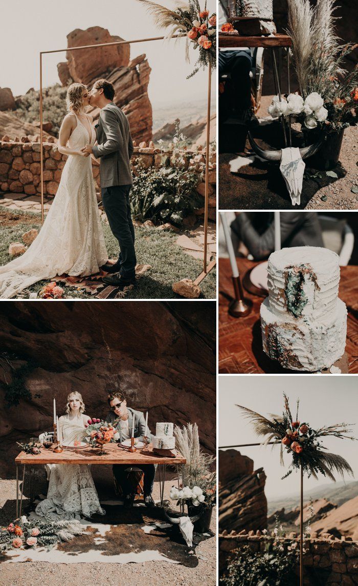 a couple standing next to each other in front of a table with cake on it