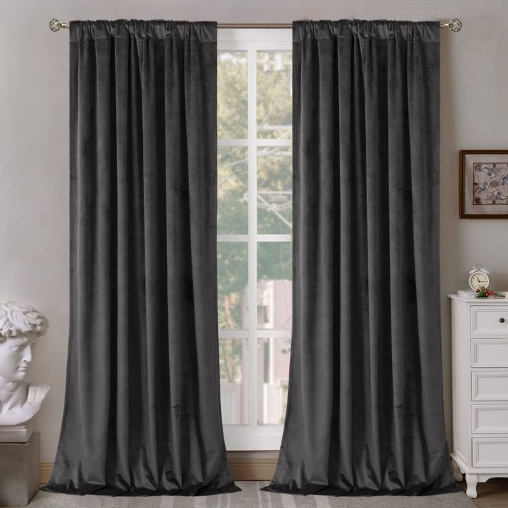 the curtains in this room are dark gray