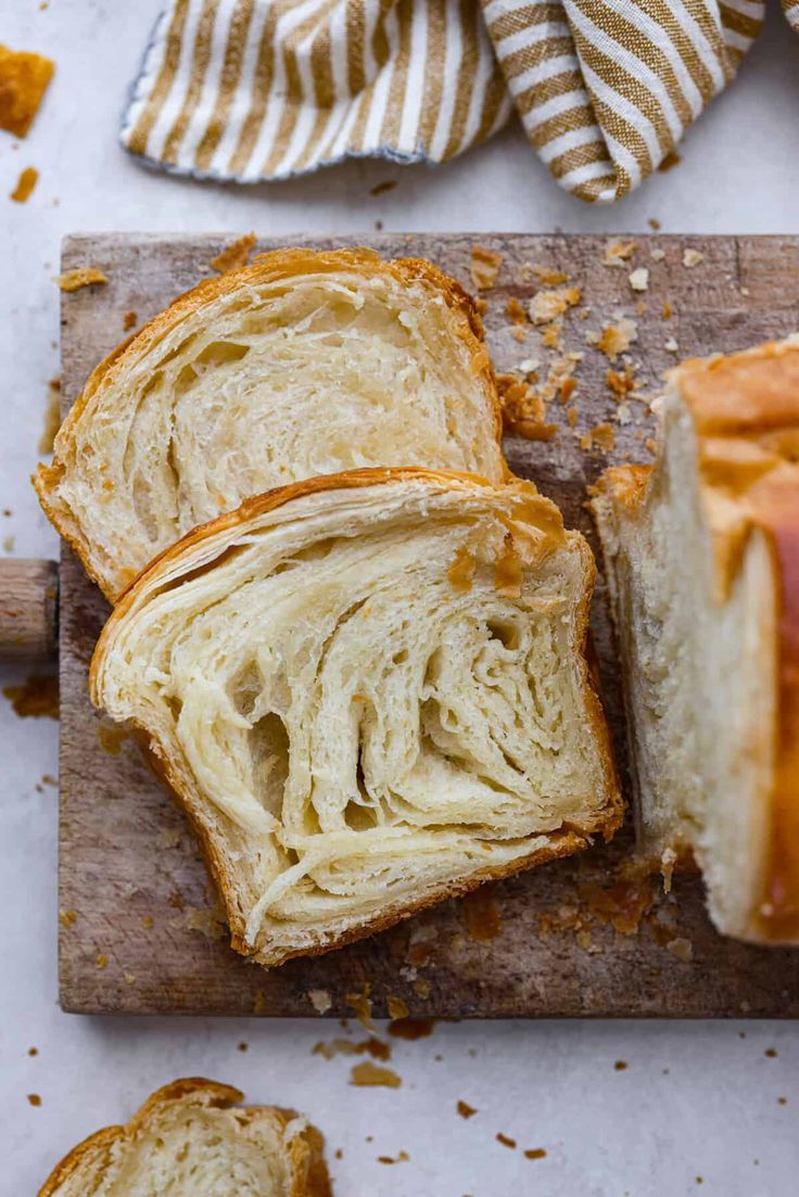 a loaf of bread sitting on top of a cutting board