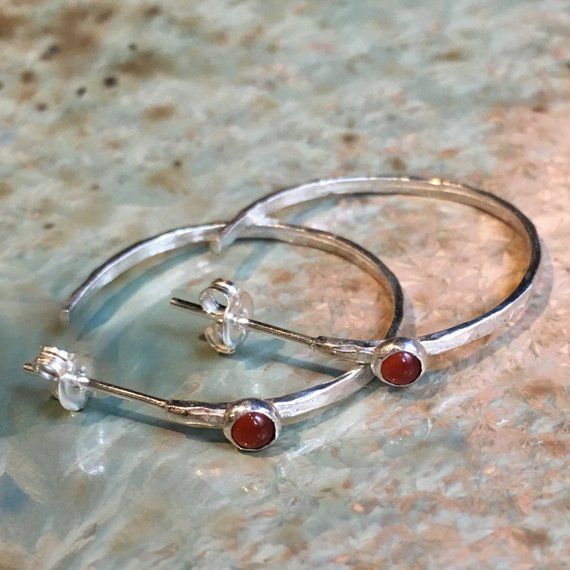 Edge~~~~~~~~These are simple hoop earrings set with small carnelian gemstones. These minimalist earrings will match everything you wear. The earrings are not heavy and very comfortable. E8073.Construction & Dimensions:~~~~~~~~~~~~~~~~~~~~~~~sterling silver, opals or carnelianApproximate diameter: 24mm About our jewelry~~~~~~~~~~~~~~ All of artisanfield jewelry collection is handmade.We  make the artisanfield designs from a goldfilled wire. *If, for any reason, you are not completely satisfie Dainty Small Hoop Gemstone Earrings, Everyday Sterling Silver Hoop Earrings With Birthstone, Dainty Sterling Silver Hoop Earrings With Gemstone, Dainty Small Hoop Earrings With Birthstone, Minimalist Small Hoop Birthstone Earrings, Minimalist Round Birthstone Hoop Earrings, Minimalist Round Hoop Earrings With Birthstone, Minimalist Gemstone Hoop Earrings For Gift, Minimalist Birthstone Hoop Earrings