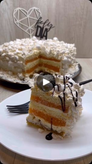 a piece of cake on a plate with a fork and knife in front of it