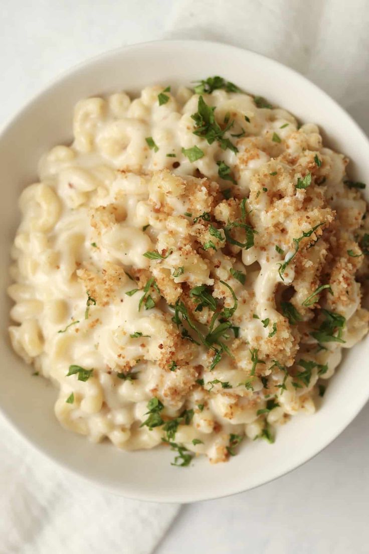 a white bowl filled with macaroni and cheese