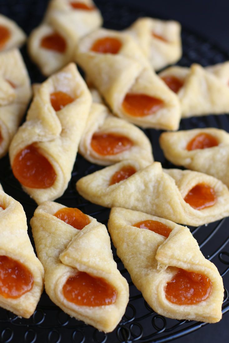 small pastries with pepperoni are on a cooling rack, ready to be eaten